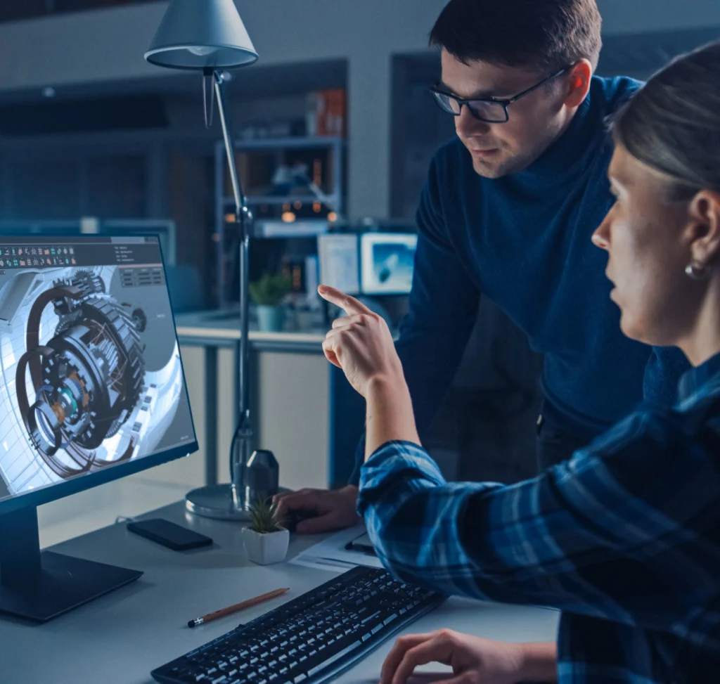 Engineers reviewing a CAD model